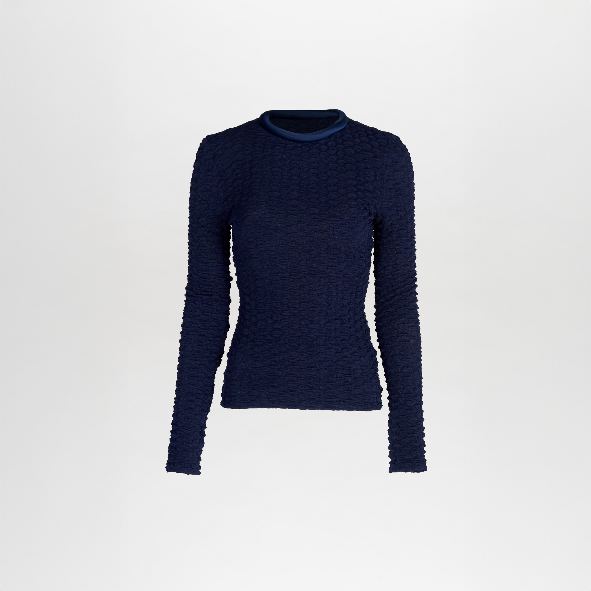 The Jari Top in navy blue is a long-sleeve with a textured knit-like fabric, fitted silhouette, and round neckline, set against a plain white background.