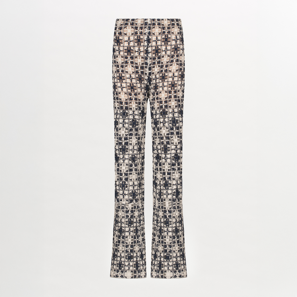 A Joan Pant Navy White Crochet with a pattern in lace fabric.