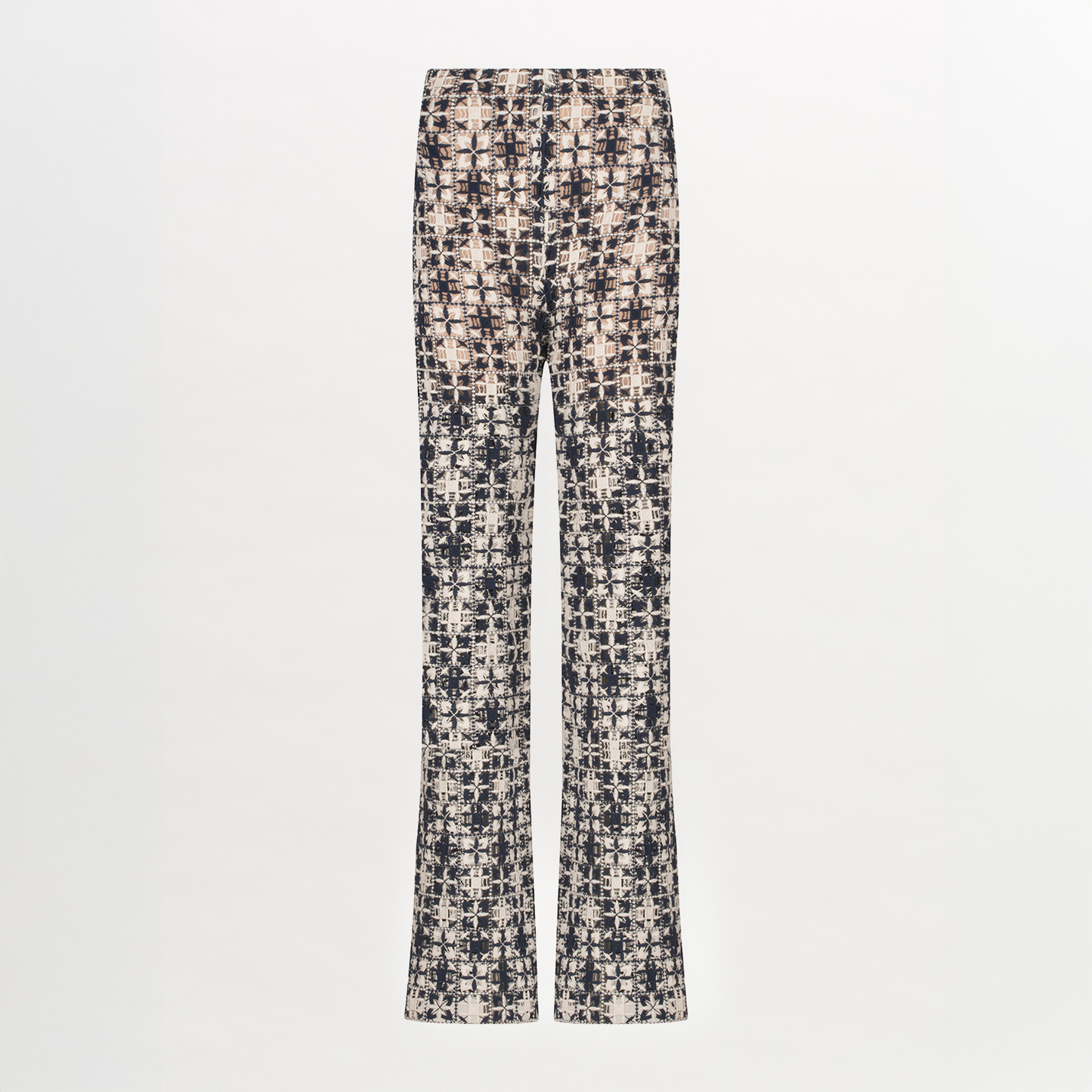 A Joan Pant Navy White Crochet with a pattern in lace fabric.