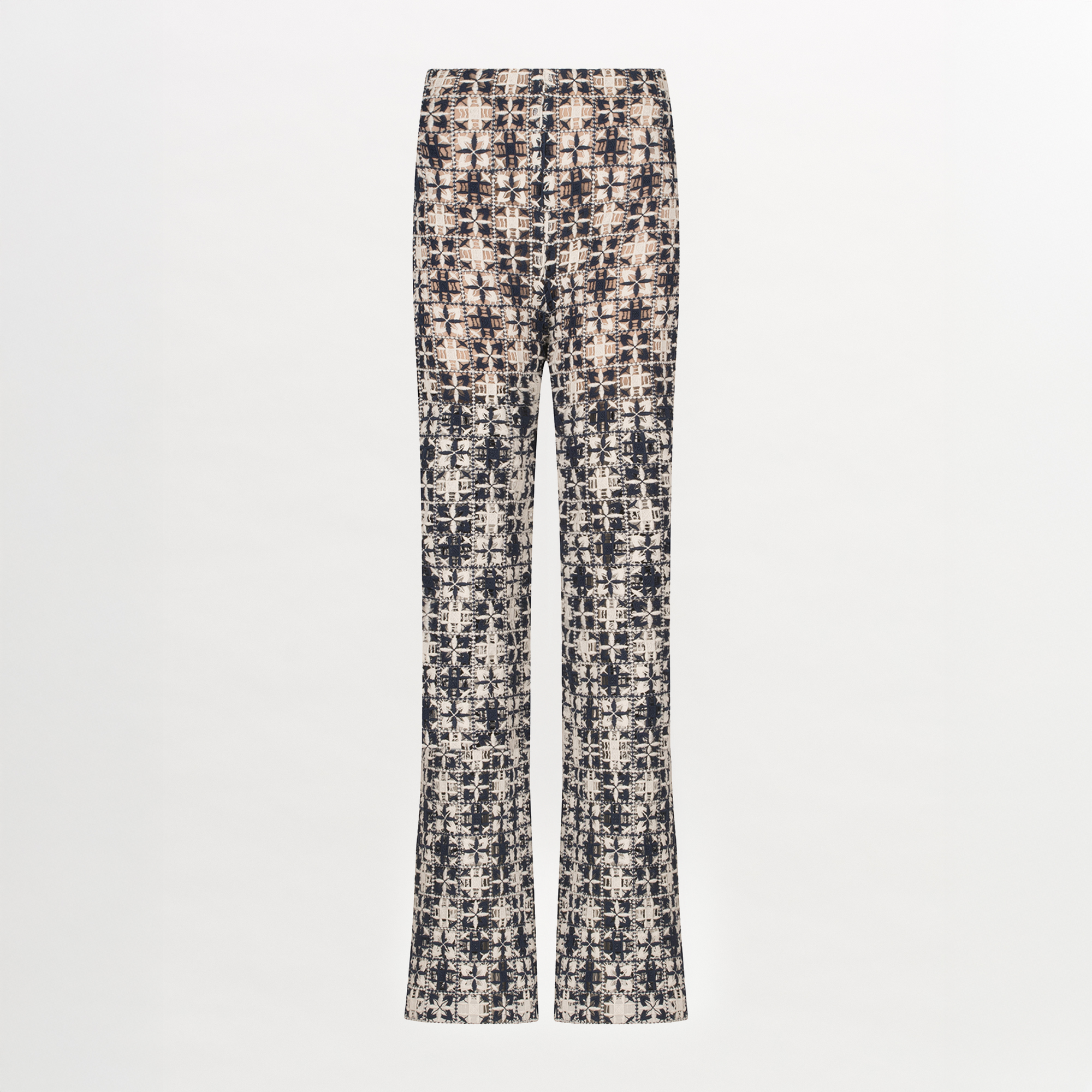 A Joan Pant Navy White Crochet with a pattern in lace fabric.