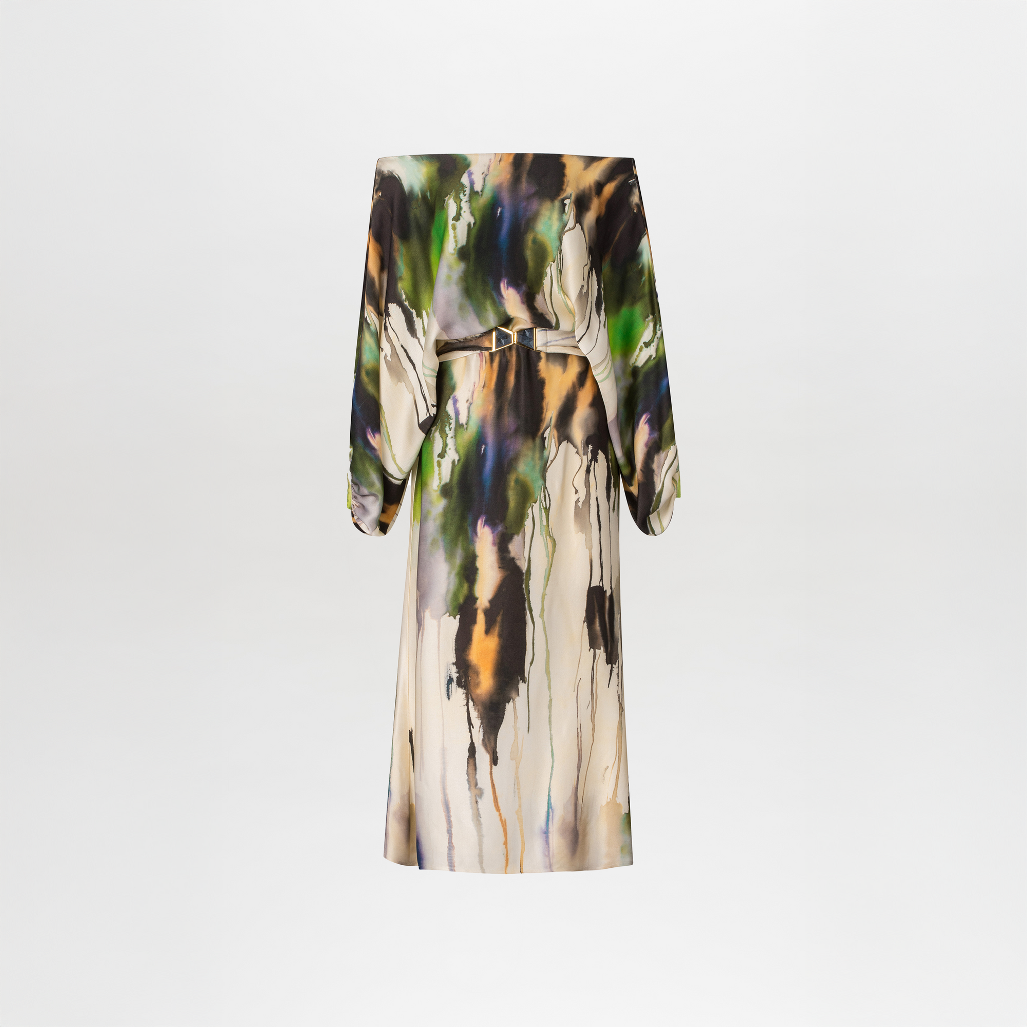 A person stands against a plain blue background, wearing the Kalani Dress in Olive Watercolor with beige high-heeled sandals. They have light skin, their hair is pulled back, and the style feels effortlessly chic, perfect for an August 19th or September 2nd event in 2024.