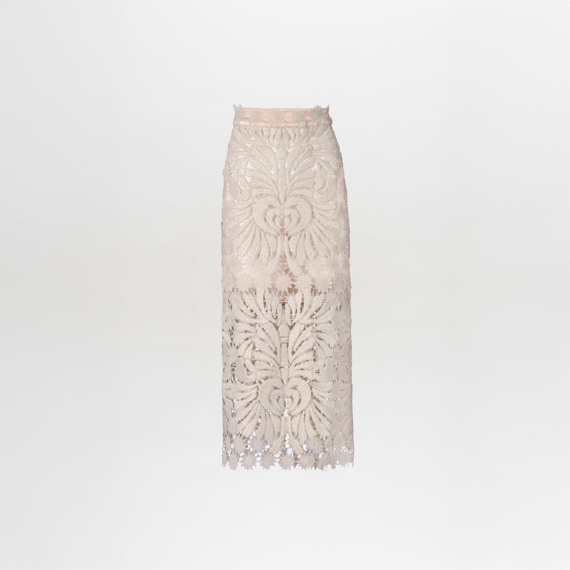 The Kin Skirt is a high-waisted midi piece made from beige lace, showcasing intricate floral and wave designs on a plain white background.