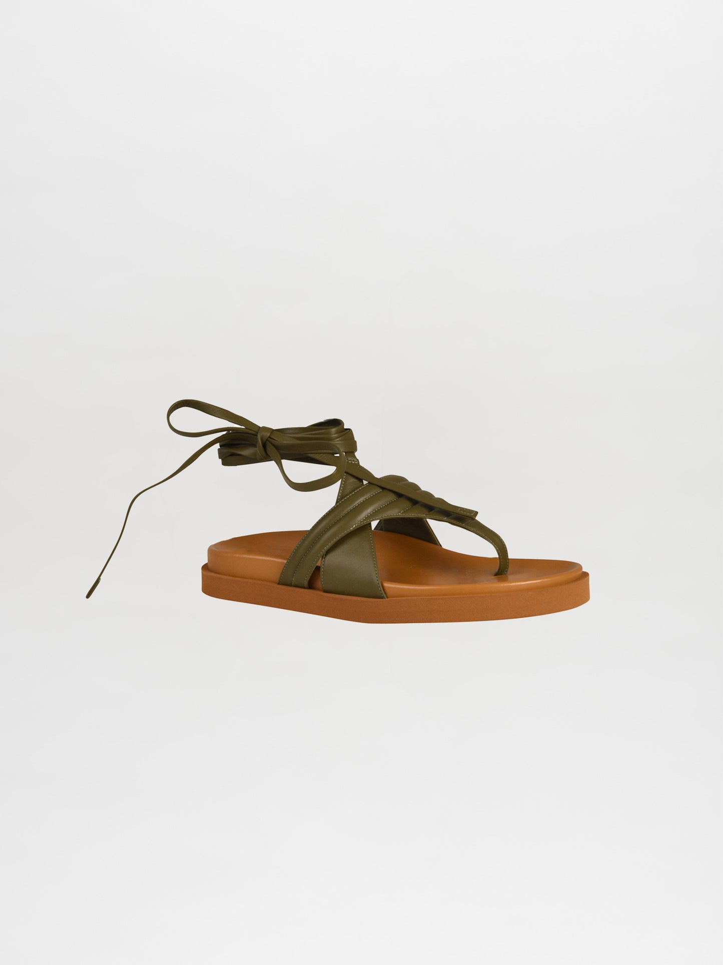 The Kristina Sandals Olive highlight a strappy design in green with a flat brown sole set against a white background, showcasing luxurious Italian calf leather crafted in a quilted toe-thong style.