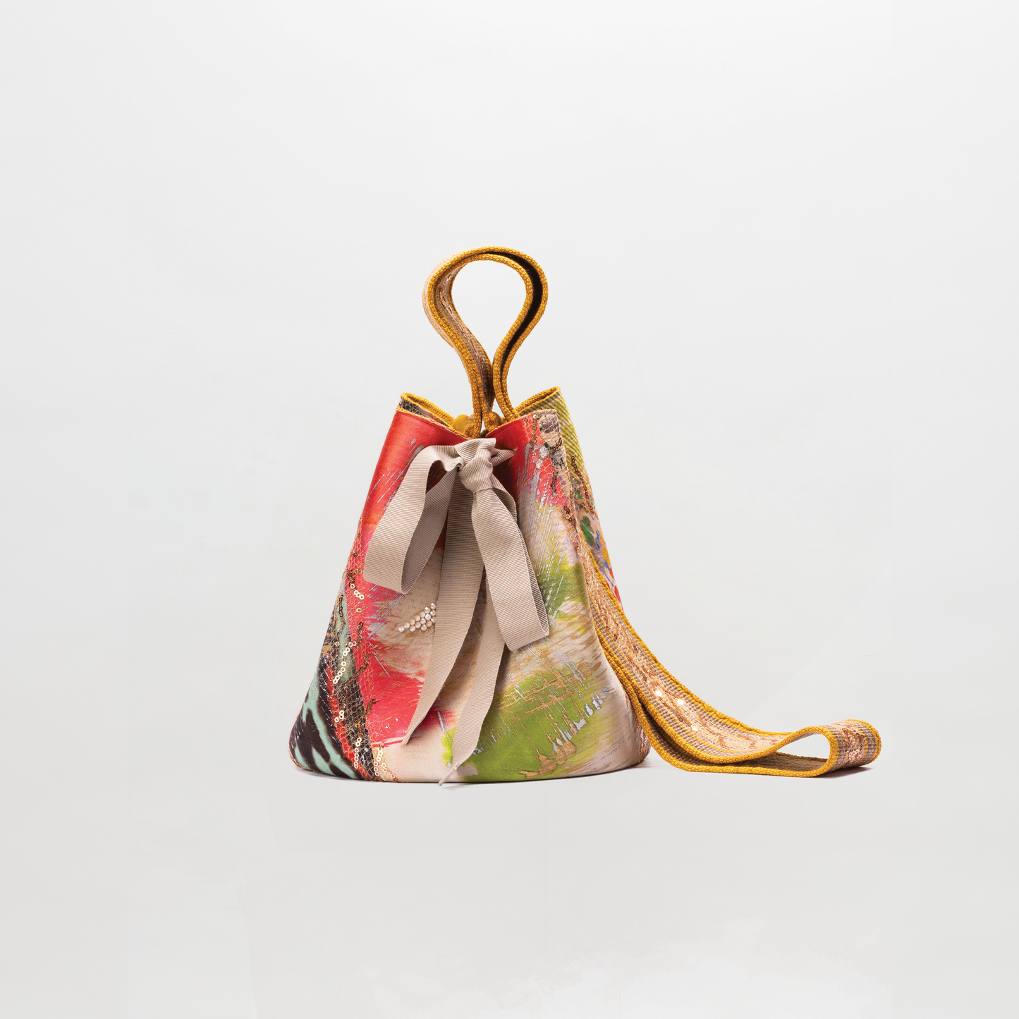 Colorful handbag with a floral pattern on a light gray background