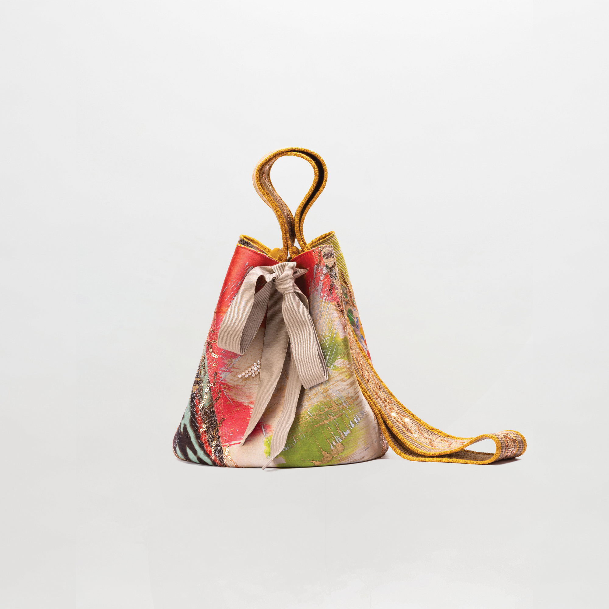 Colorful handbag with a floral pattern on a light gray background