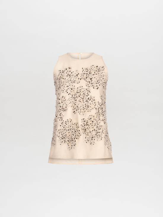 Pre-order our Leonora Blouse Beige Black Embroidered Flowers featuring intricate floral lace detailing and small beads on the front, set to ship in 2024.