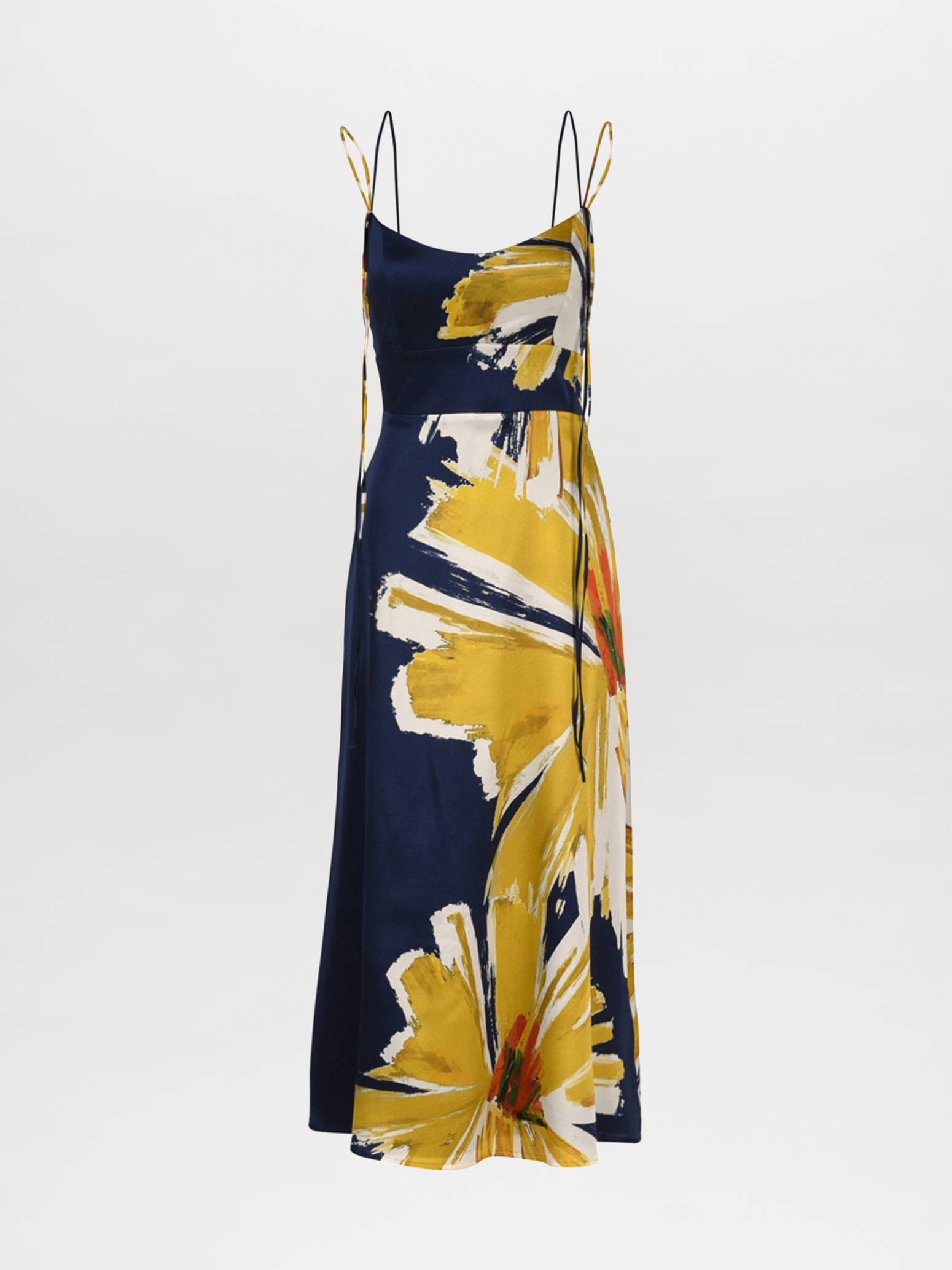 The Lizzo Dress Navy Floral Brushstrokes is a silk navy midi dress with spaghetti straps, showcasing a large yellow and white floral print alongside an A-line skirt.