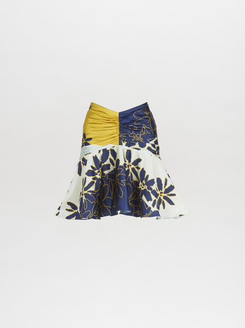 This Loriana Skirt Navy Citrine is made of floral fabric and features an invisible zipper.