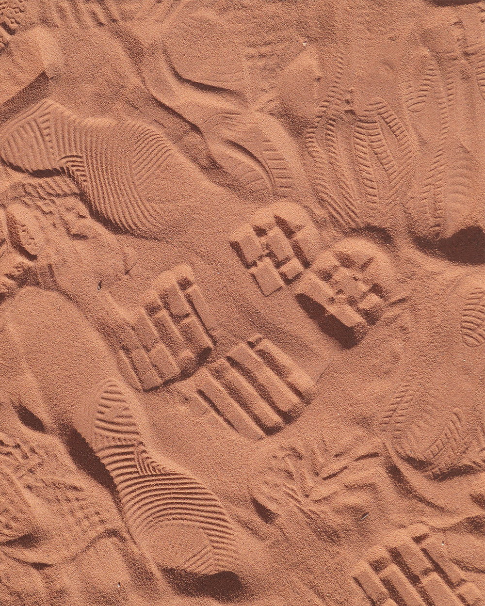 Close-up of a textured surface with embossed characters and patterns