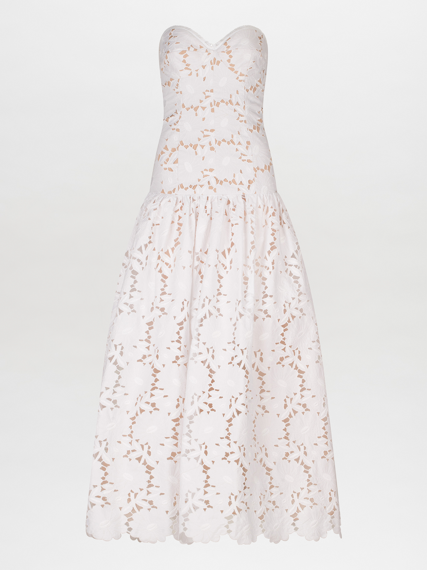 A Margie Dress White with delicate lace detailing.