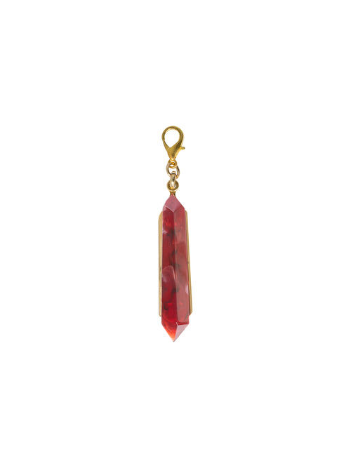 Introducing the Mariela Charm Rouge: A stunning red crystal pendant with a gold setting and clasp, perfect for any occasion. Order now for shipping on September 2nd.