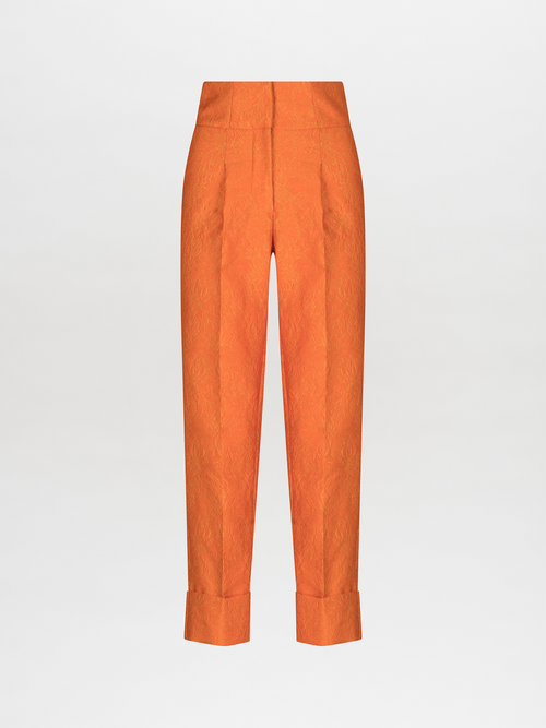 A pair of Moad Pant Orange Petal with pleating details.