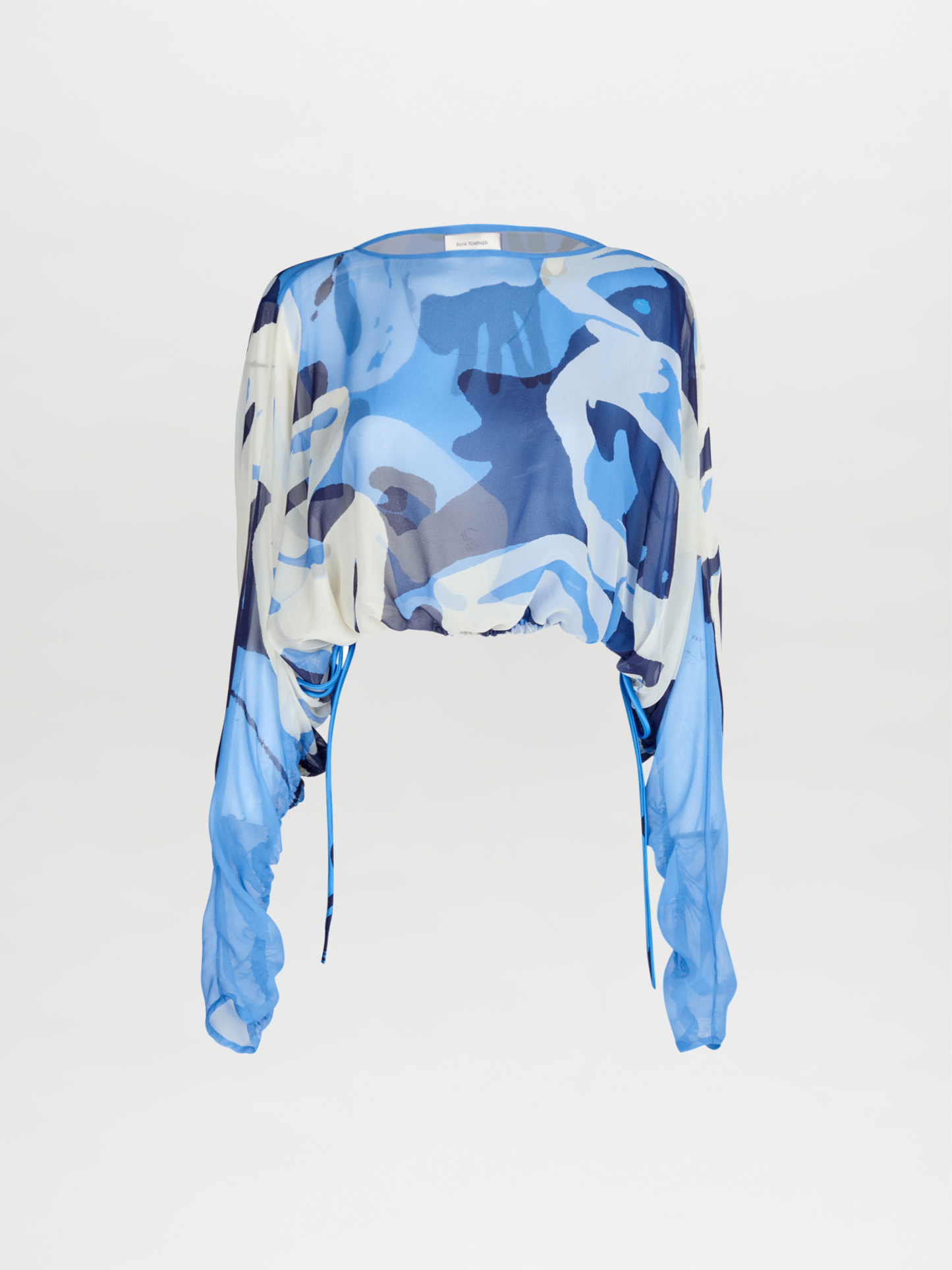 A Macerata Blouse Celeste Bloom with a printed camouflage pattern.