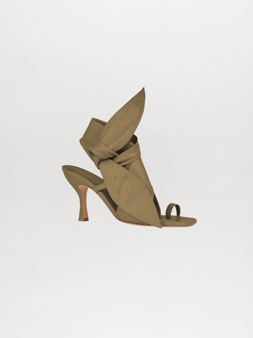 Introducing the Marco Heel Olive Green, a high-heeled sandal with an open-toe design featuring large, leaf-shaped straps and crafted from luxurious Italian calf leather.