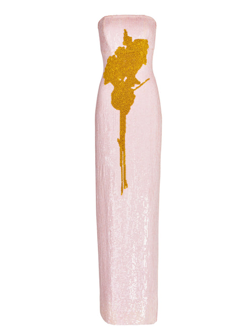 A Margaret Dress Yellow Nude Floral hand-embroidered with a gold flower.