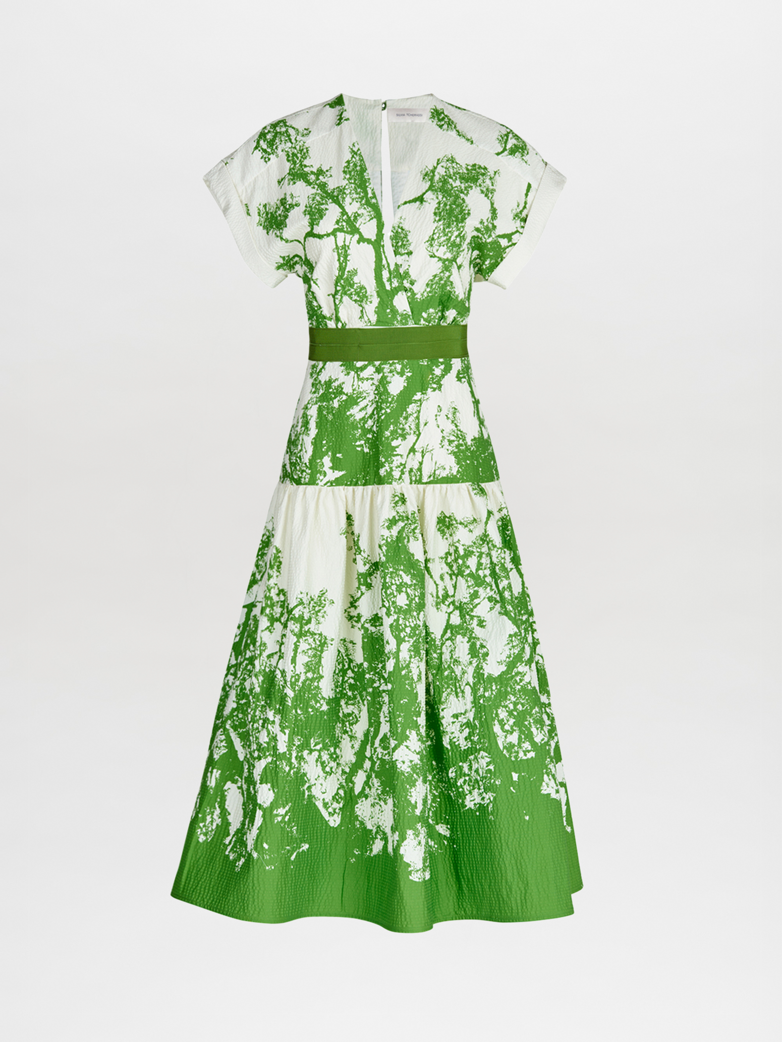 A Metaponto Dress Green Cyprus in a nature-inspired print of green and white florals.