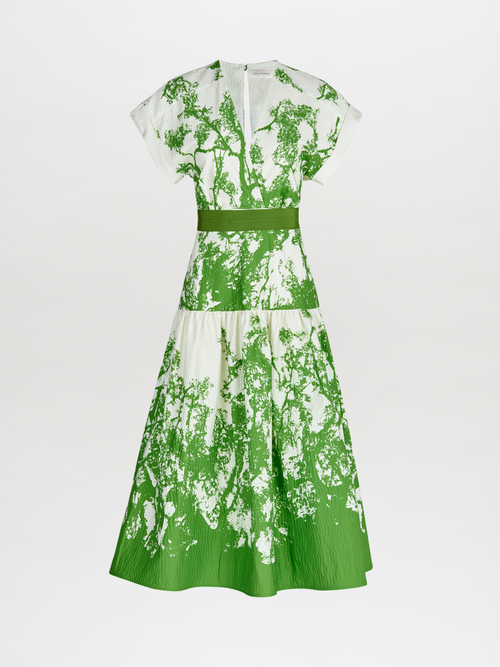 A Metaponto Dress Green Cyprus in a nature-inspired print of green and white florals.