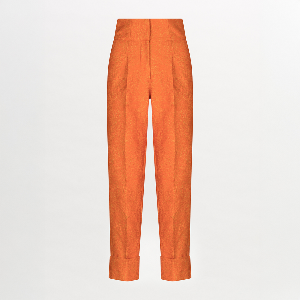 A pair of Moad Pant Orange Petal with pleating details.