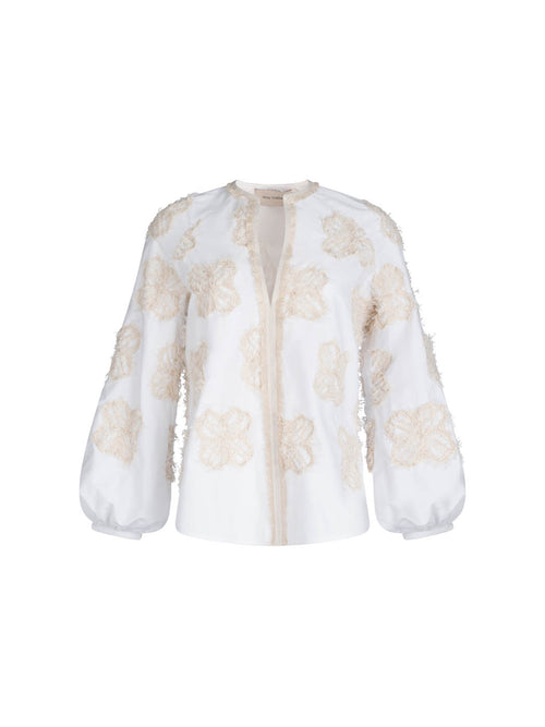 A Molveno Blouse Cream Flowers with long sleeves and golden floral motifs, isolated on a white background.