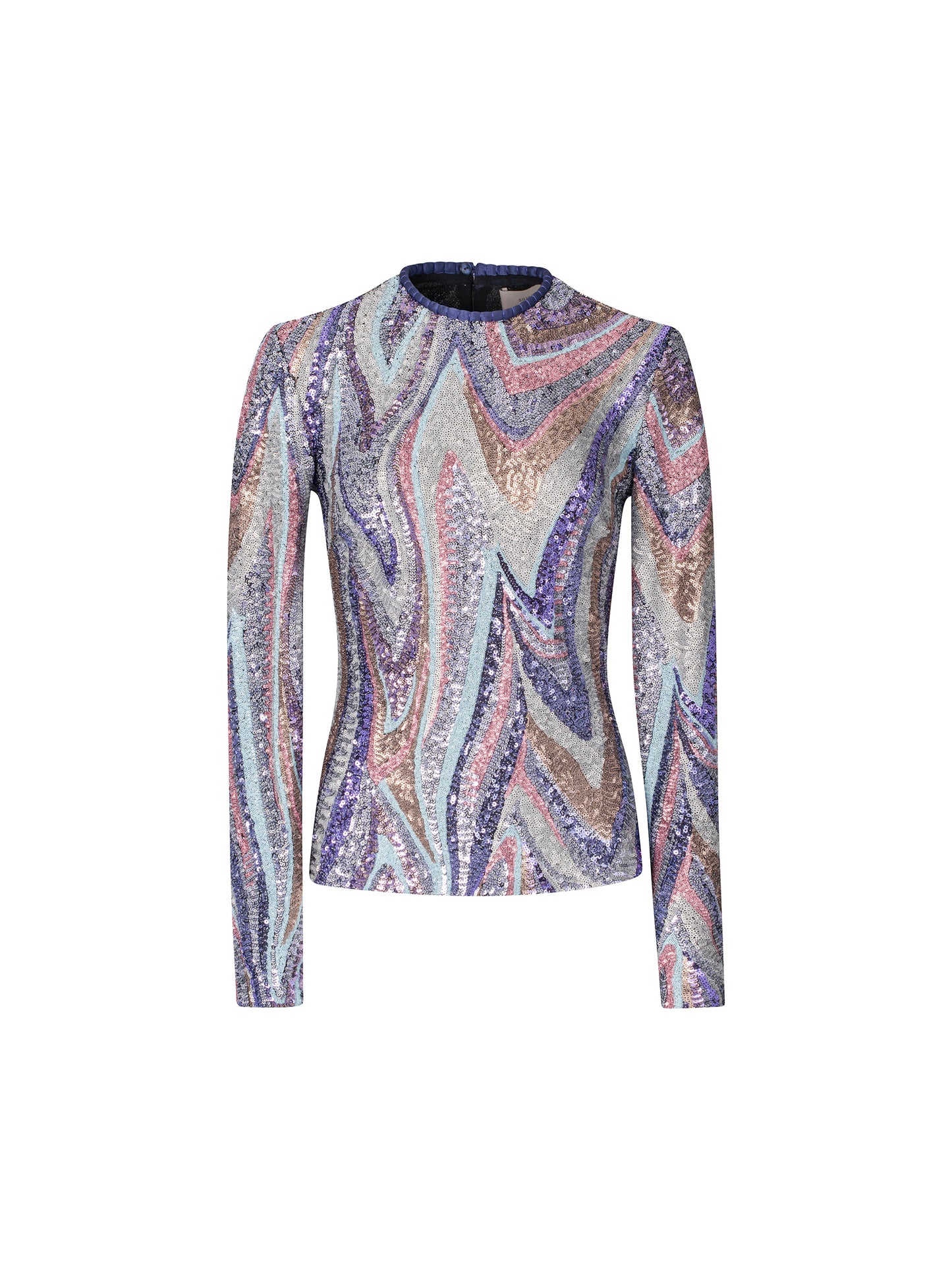 A woman with light brown hair is wearing the Nara Top Sequin Waves, a long-sleeve top featuring a multicolored wavy sequin pattern, paired with high-waisted purple pants against a plain blue background, creating an ensemble perfect for the upcoming events this August 19th.