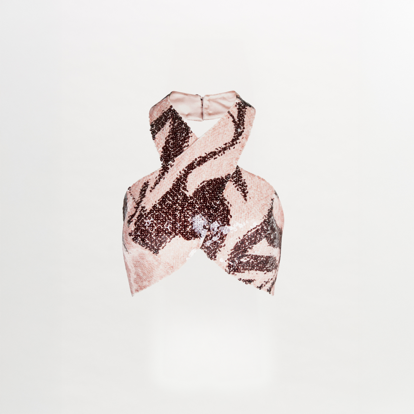 A Nahia Top Cacao Rose with a zebra print and halter neckline.