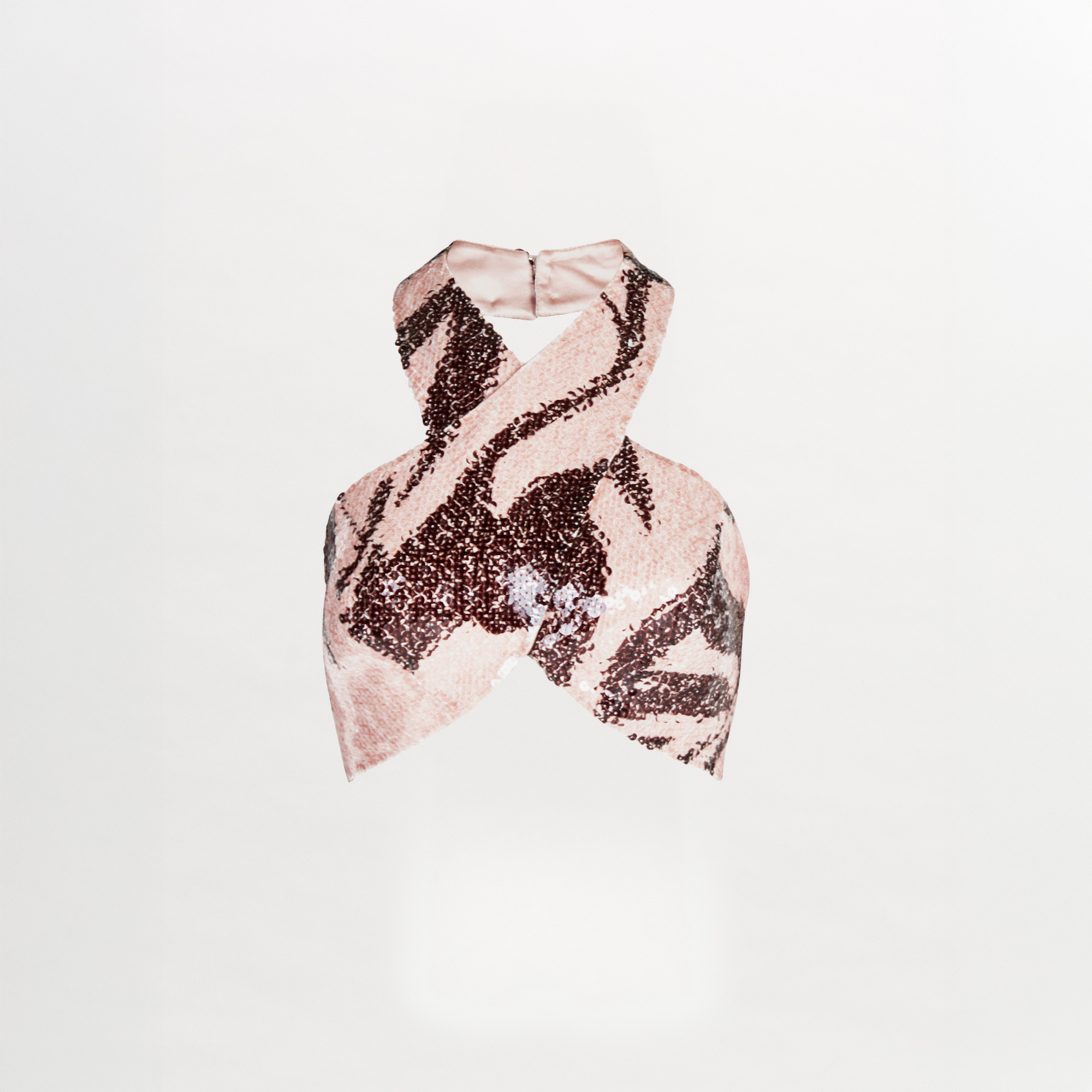 A Nahia Top Cacao Rose with a zebra print and halter neckline.