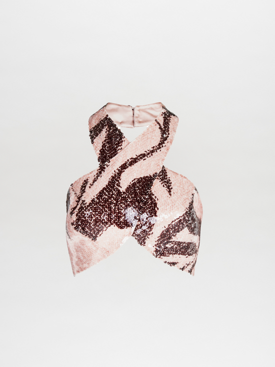 A Nahia Top Cacao Rose with a zebra print and halter neckline.