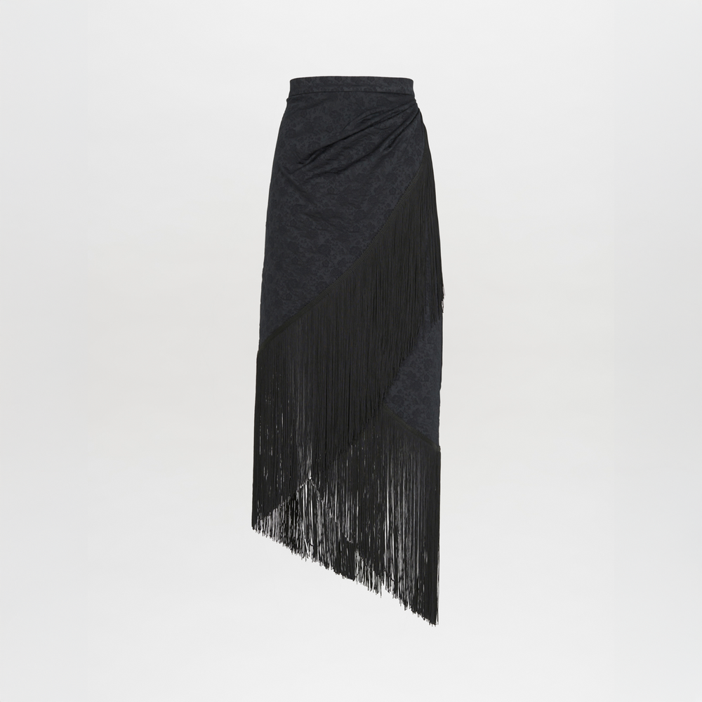 A black skirt with fringes on an asymmetrical hem, resembling the Natalia Skirt Black.