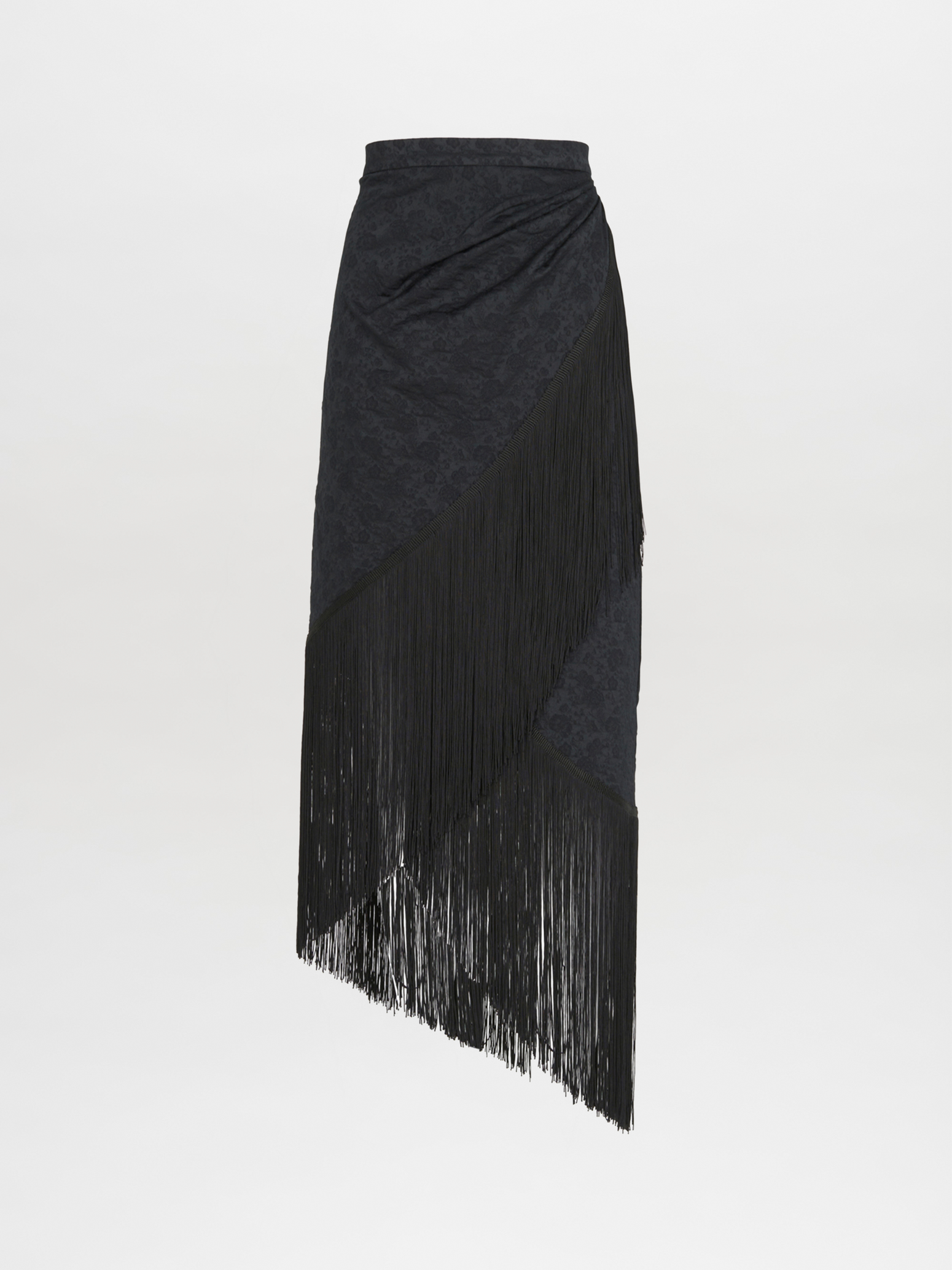 A black skirt with fringes on an asymmetrical hem, resembling the Natalia Skirt Black.