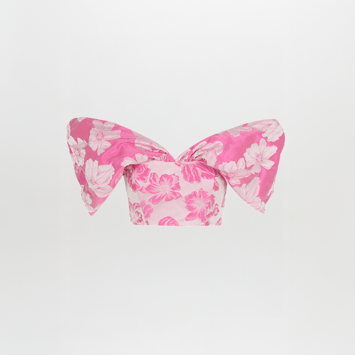 Magenta floral Natasha Top featuring prominent shoulder ruffles against a solid background.