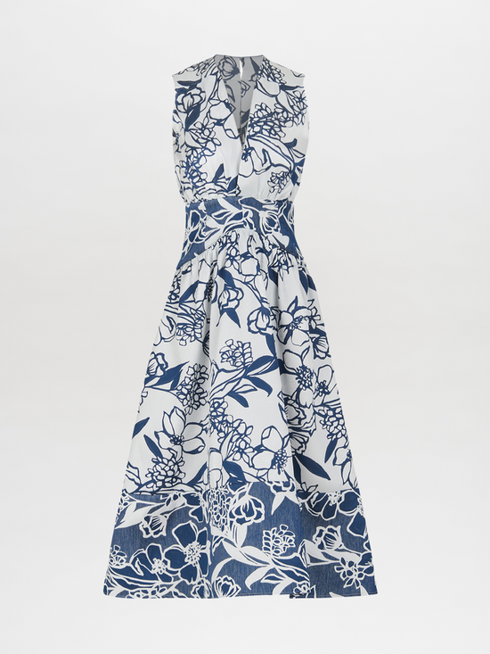 The Nayla Dress Navy Whimsical Garden is a sleeveless white dress with a deep V-neck and a flared skirt, boasting a blue floral print and a charming retro silhouette.