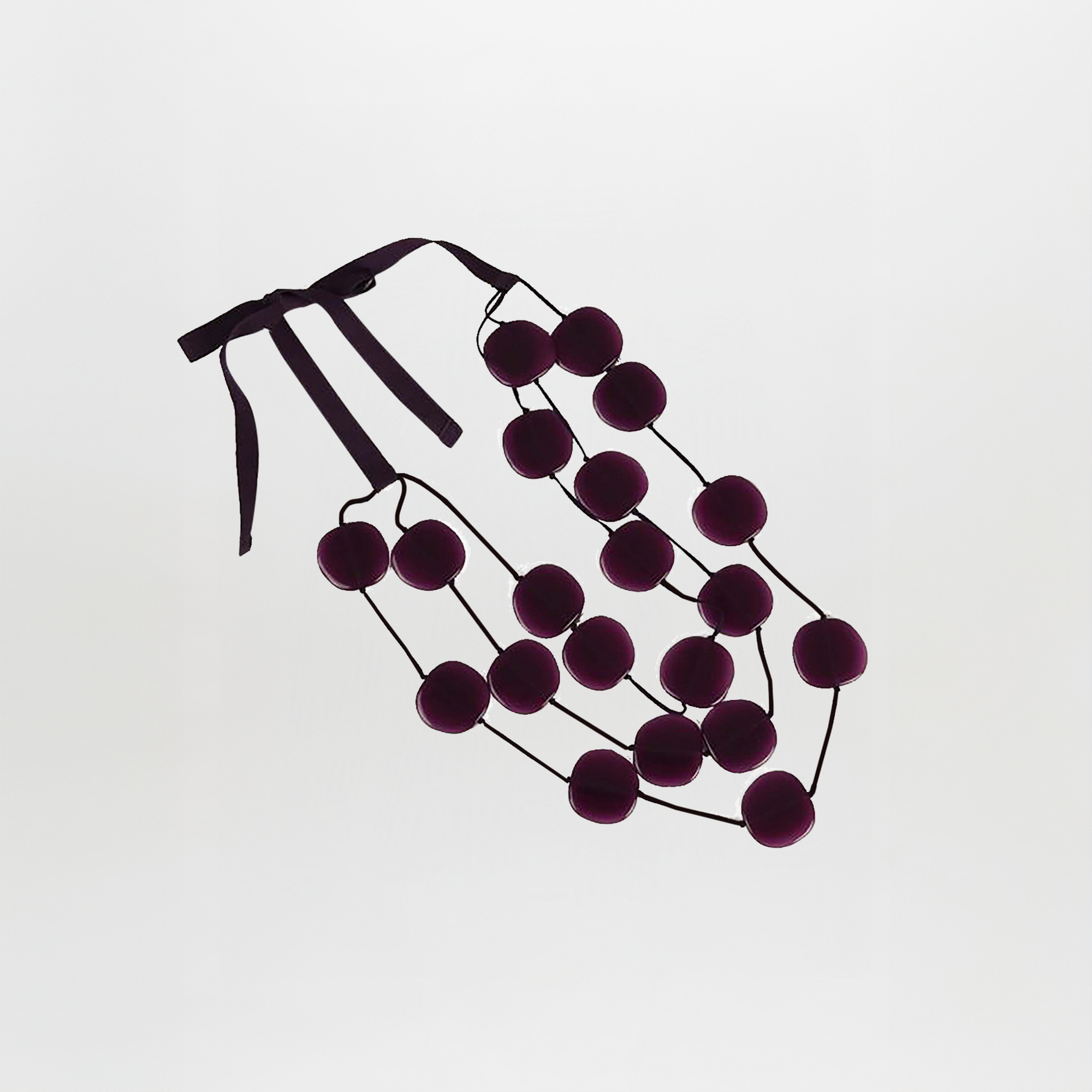 The Olivia Necklace Grape features two strands of large, round Italian resin beads in a rich grape hue and a matching ribbon tie, shown against a plain white background.