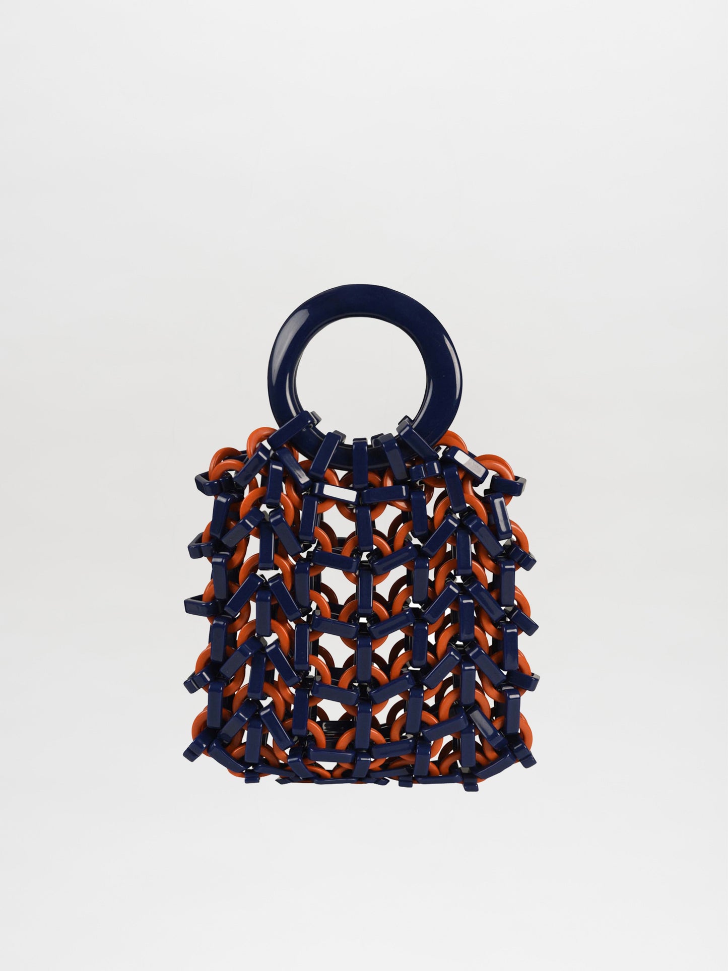 The Omegna Handbag in navy and orange is a stylish accessory featuring a knit-like resin texture and a round handle.