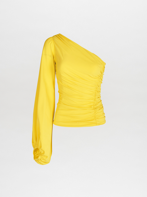 A Oriana Blouse Yellow made of georgette fabric.