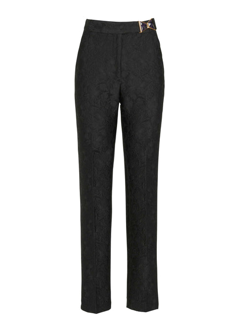 Orion Pant Black high-waisted pants with a patterned design and a gold detail on the waistband.