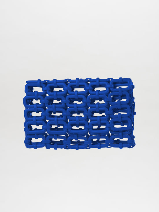 The Orvieto Clutch Blue is a structured handbag showcasing Italian resin interlocking chain links against a crisp white background.