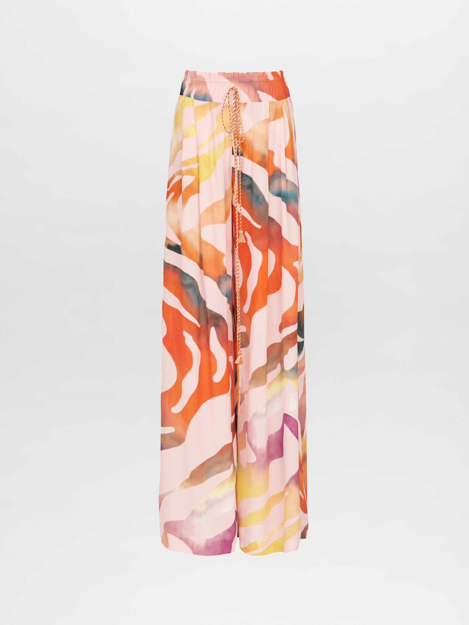 The sentence can be rewritten as: "Ovada Pant Blush Prismatic high-waisted trousers are made from crepe de viscose, showcasing a vibrant abstract pattern in shades of red, orange, and pink on a white background.