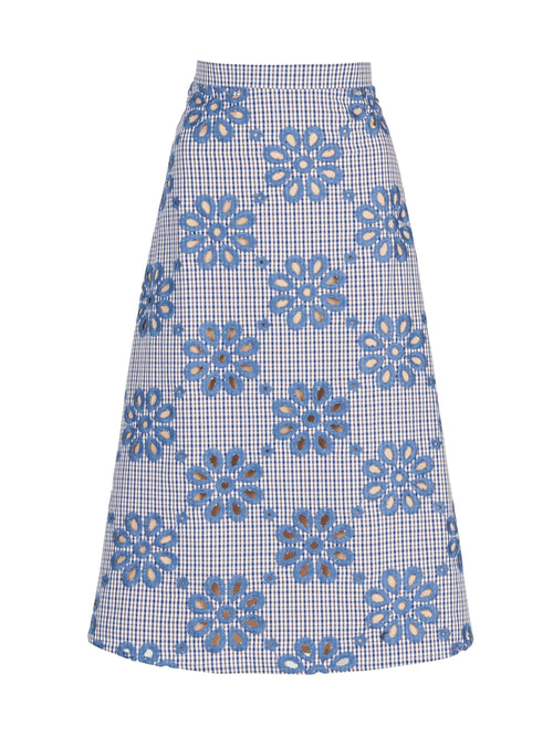 Bianca Skirt with a blue and white checkered pattern adorned with large navy floral designs.