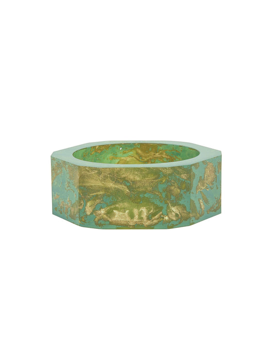 Introducing the Ruth Bangle Green: an octagonal bowl with a green and gold marbled design, featuring a ship-like wide opening and a flat base, perfect for adding to your collection. Ready to order now!