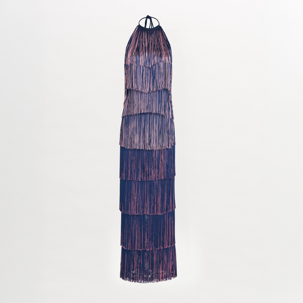 A floor-grazing fringed Paris Dress Navy with a touch of glamour in blue and pink hues.
