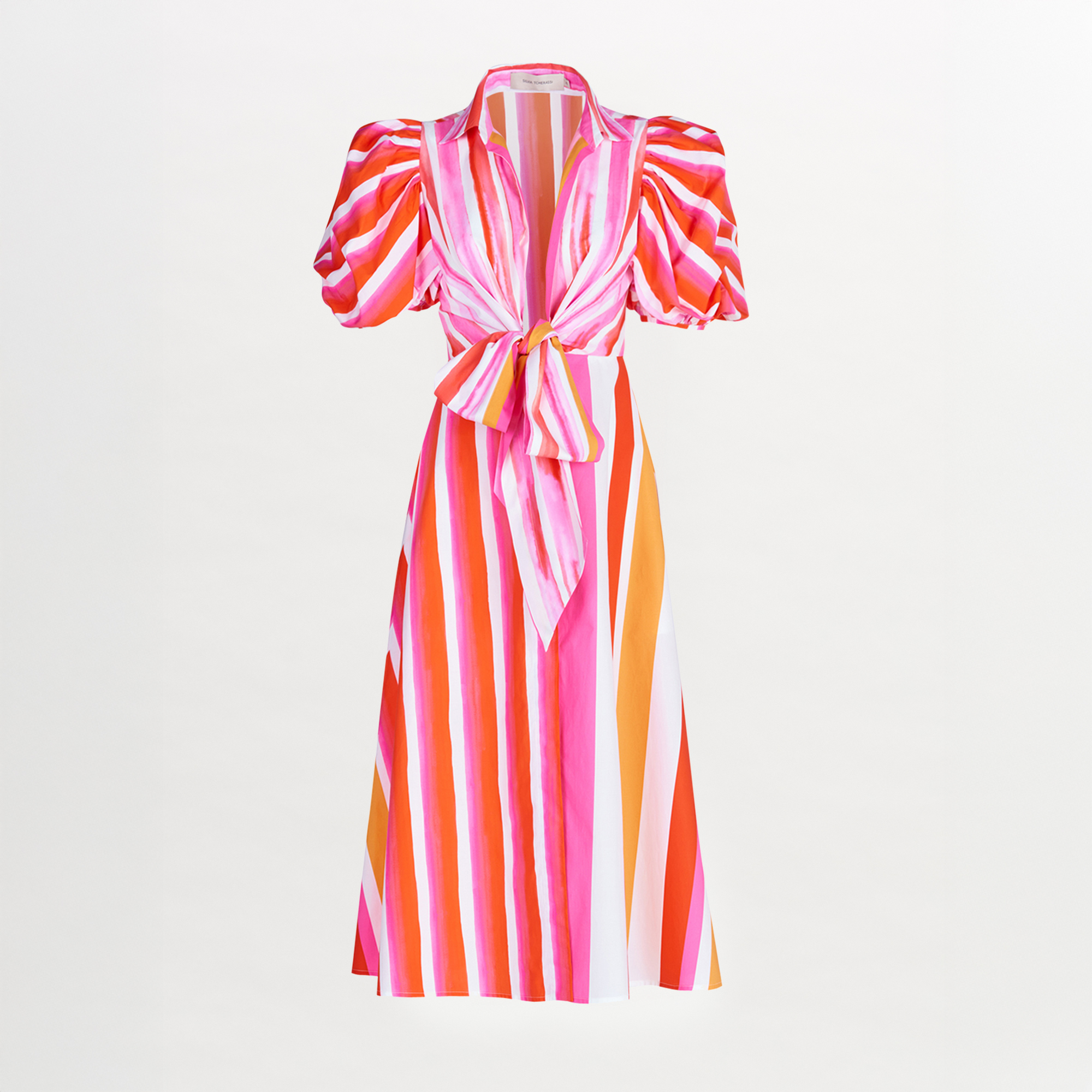 A Pavia Dress Rouge Orange Stripes with a brushstroke stripe print and a bow.