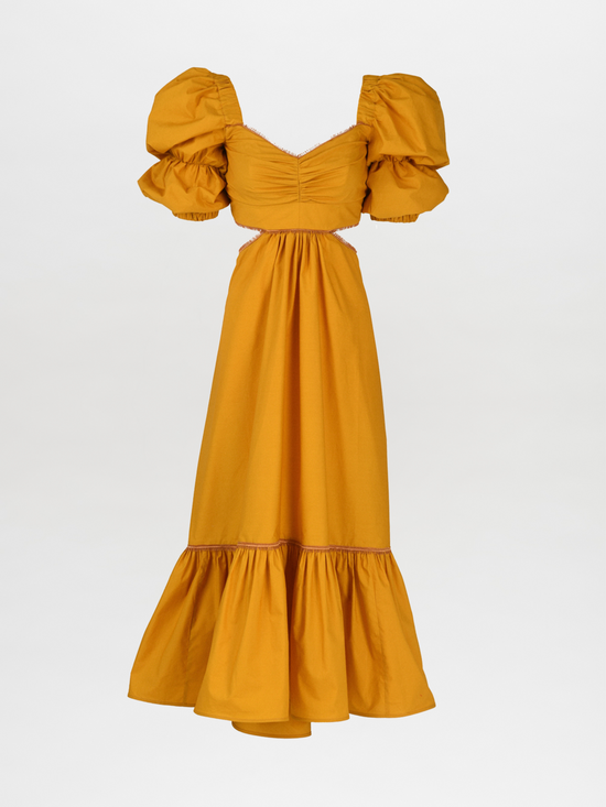 Introducing the Peggie Dress Marigold, a stunning Silvia Tcherassi dress in mustard yellow, featuring puffed sleeves, a fitted bodice, side cutouts, and a ruffled hem—an essential piece from Resort 2023.