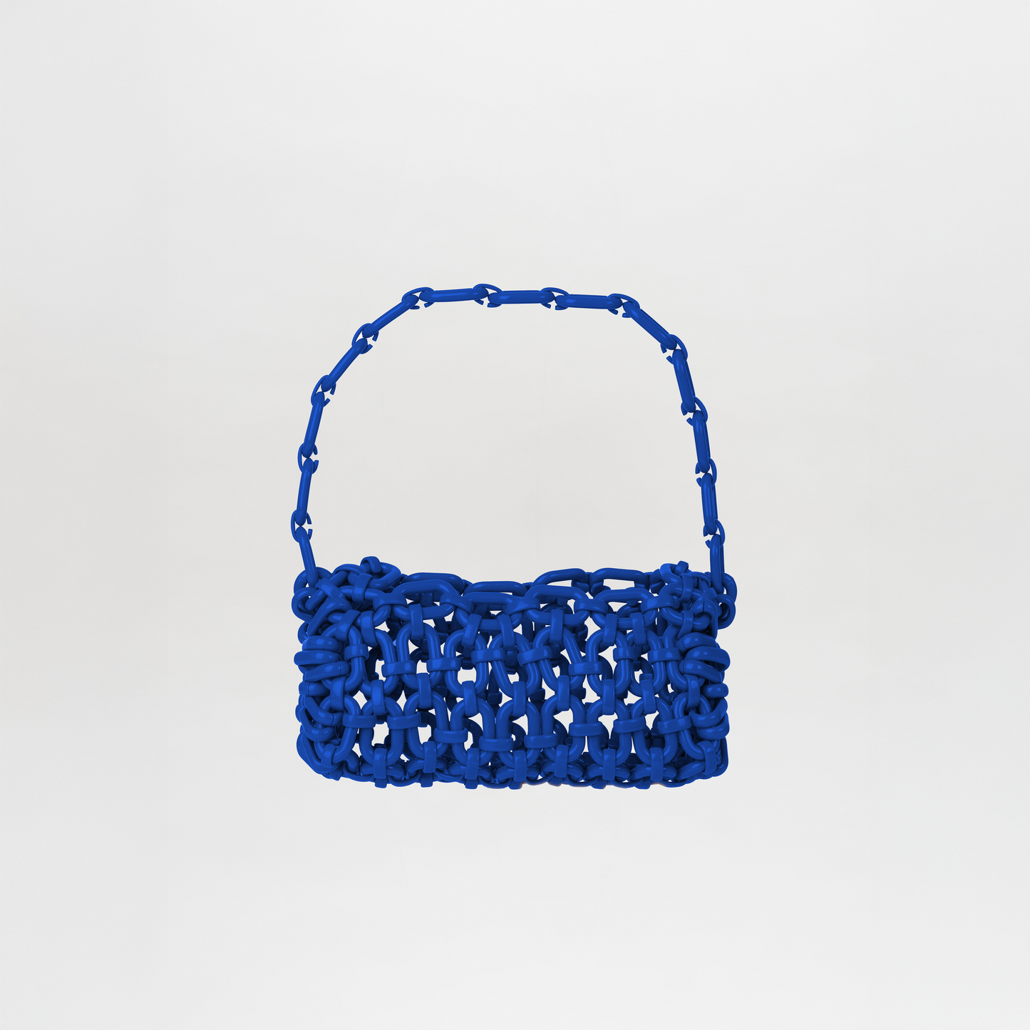 The Piceno Handbag Blue features a royal blue hue, chunky interlaced design, and a matching Italian resin chain strap, shown against a plain white background.