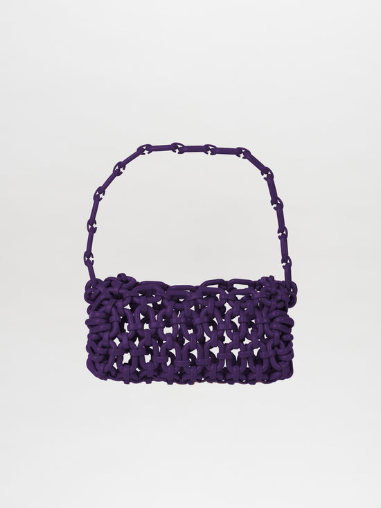 A Piceno Handbag Purple baguette with a looped handle is displayed against a plain white background.