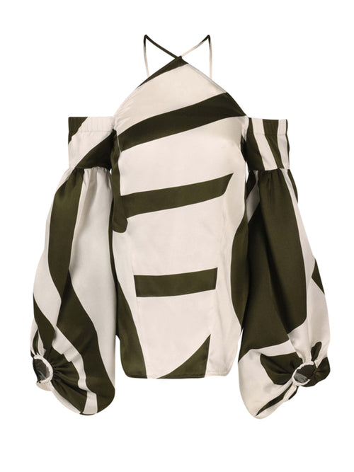 The Terry Blouse Green Abstract is a chic silk blouse showcasing a halter-neck design with off-the-shoulder details, complemented by striking green and white diagonal stripes and dramatic bishop sleeves.