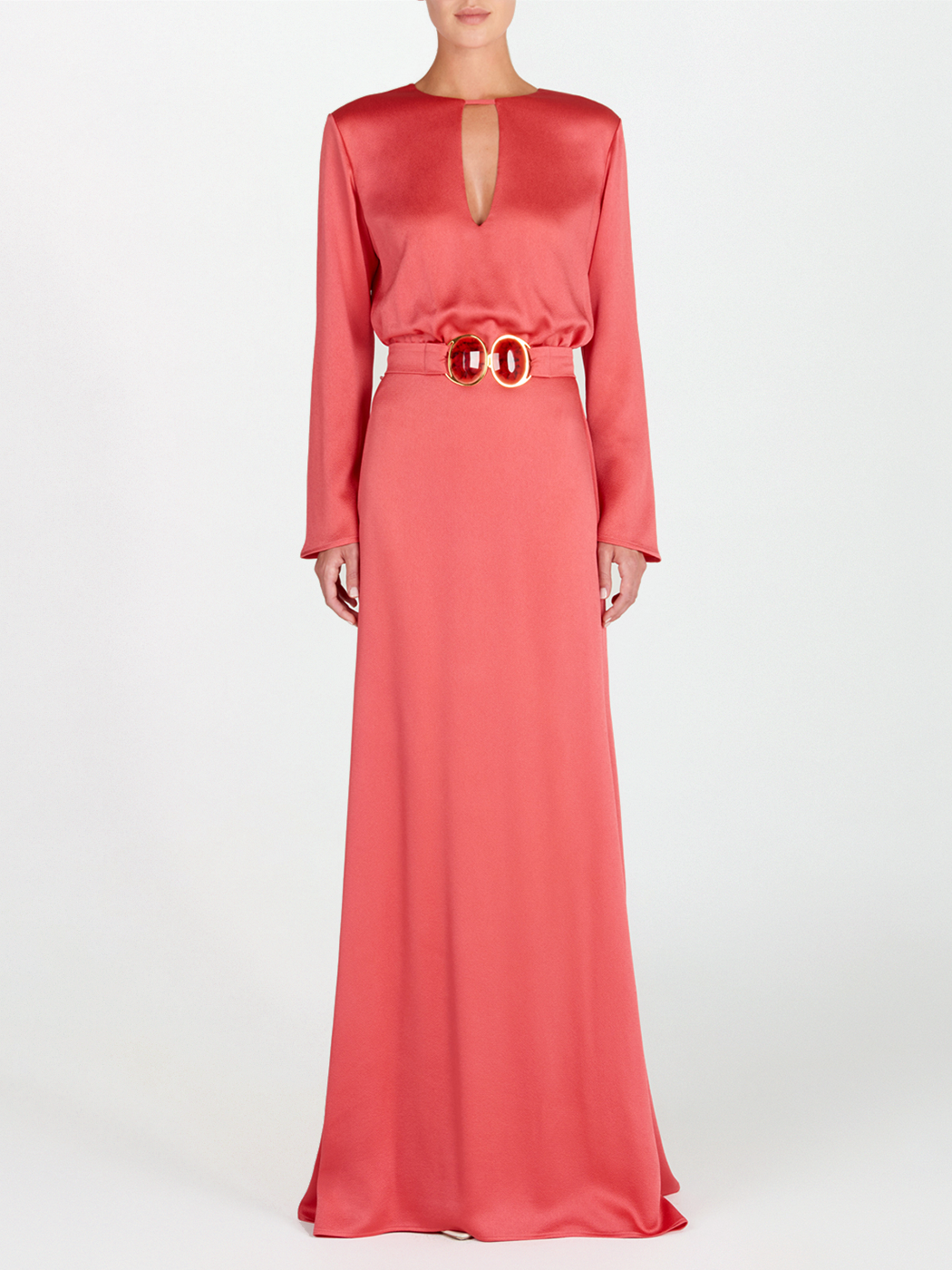 A sleek Ravenna Dress Coral floor-length dress with a belt.