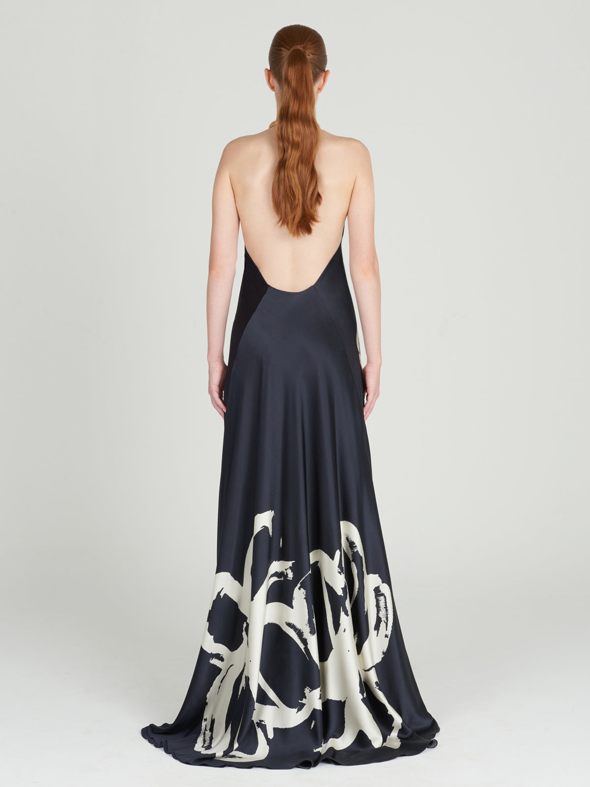 A navy Zeffa Dress Midnight Bloom with a floral abstract print.
