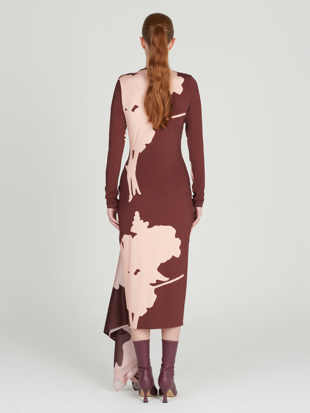 A burgundy midi Ananya Dress Cacao Floral with long sleeves in a botanical-inspired print.
