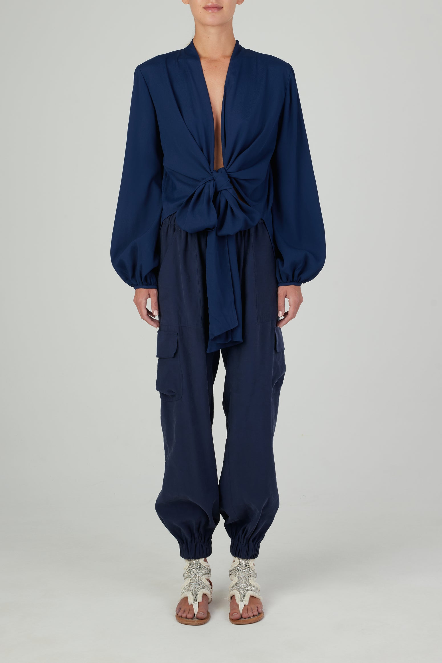 A Honey Blouse Navy with a tie at the neck, designed in a flattering cut.