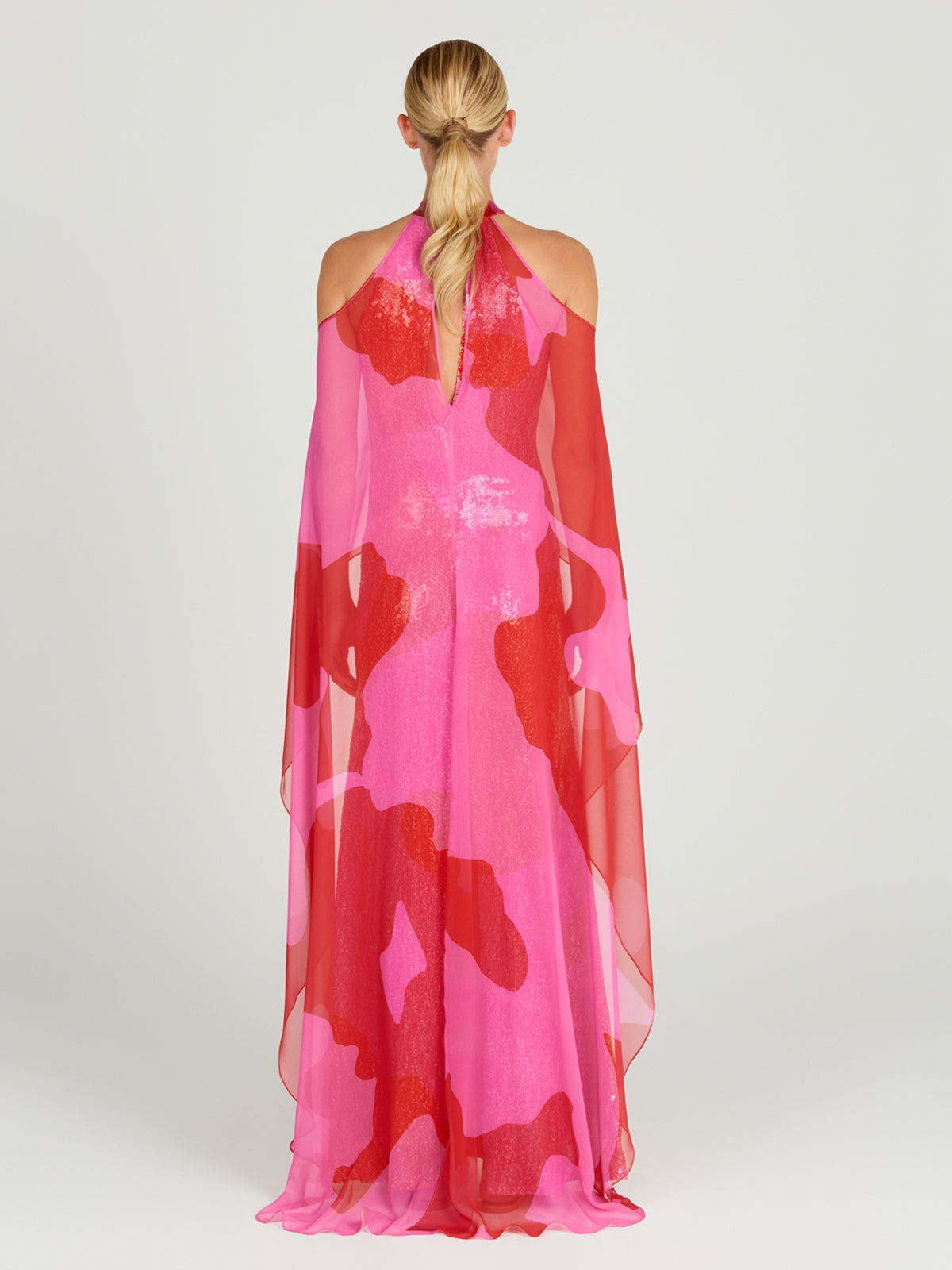 An elegant Lodi Dress Vermillion on a mannequin.